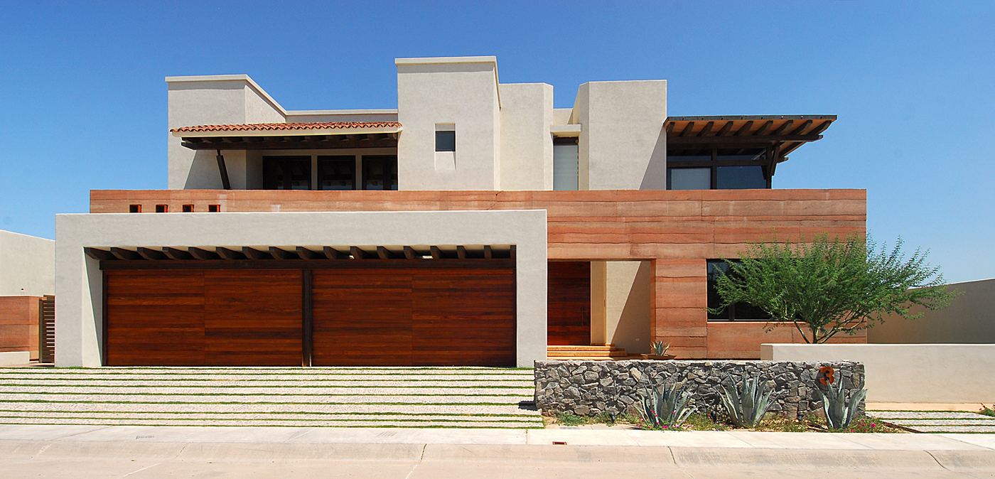 Adobe and timber residence with deep overhangs