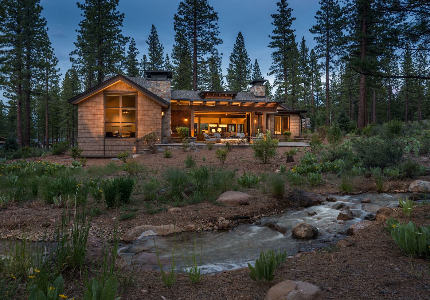 Mountain residence at dusk among pines, Martis Camp