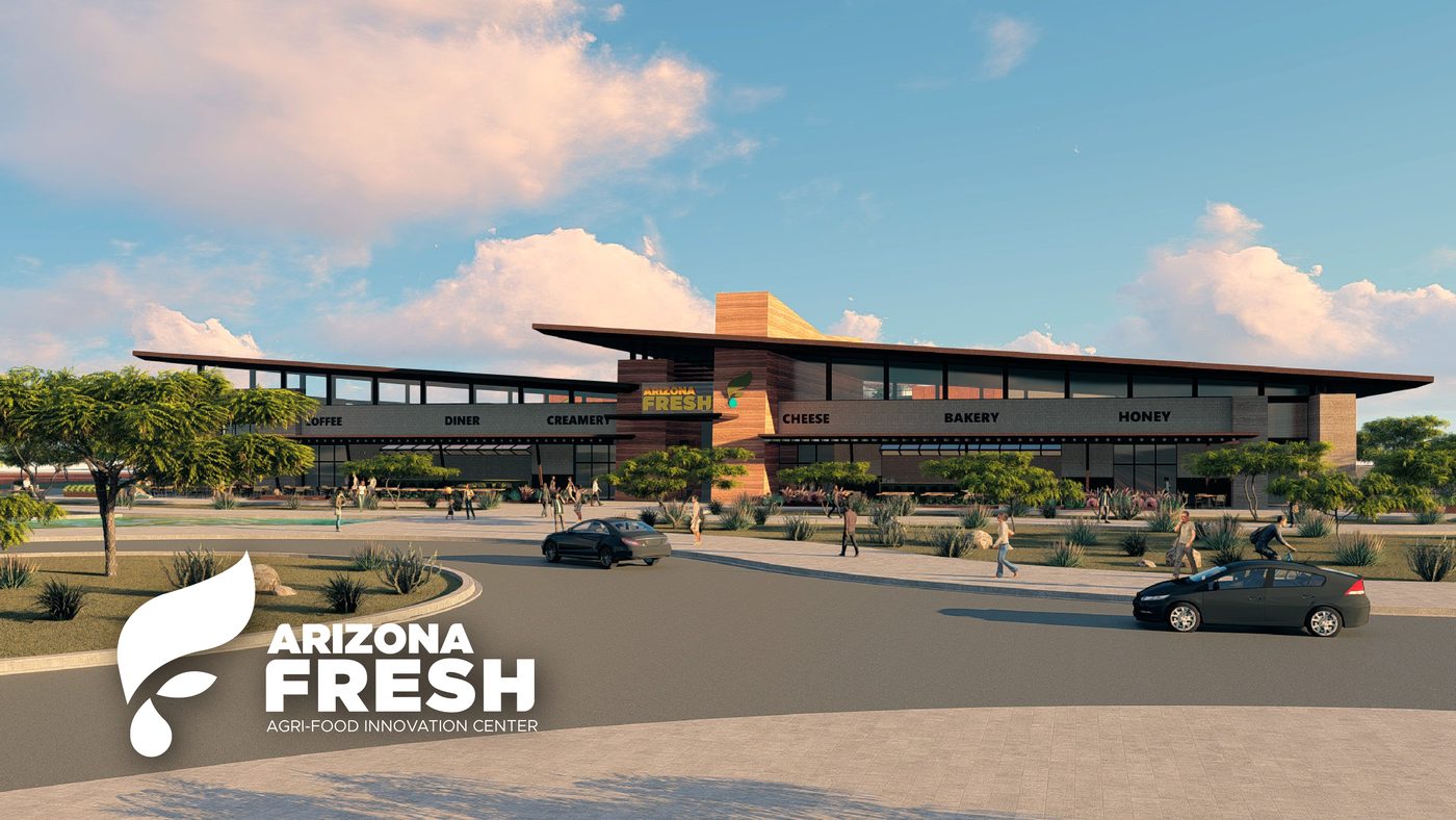 Market hall frontage with coffee, diner and creamery storefronts under a deep canopy