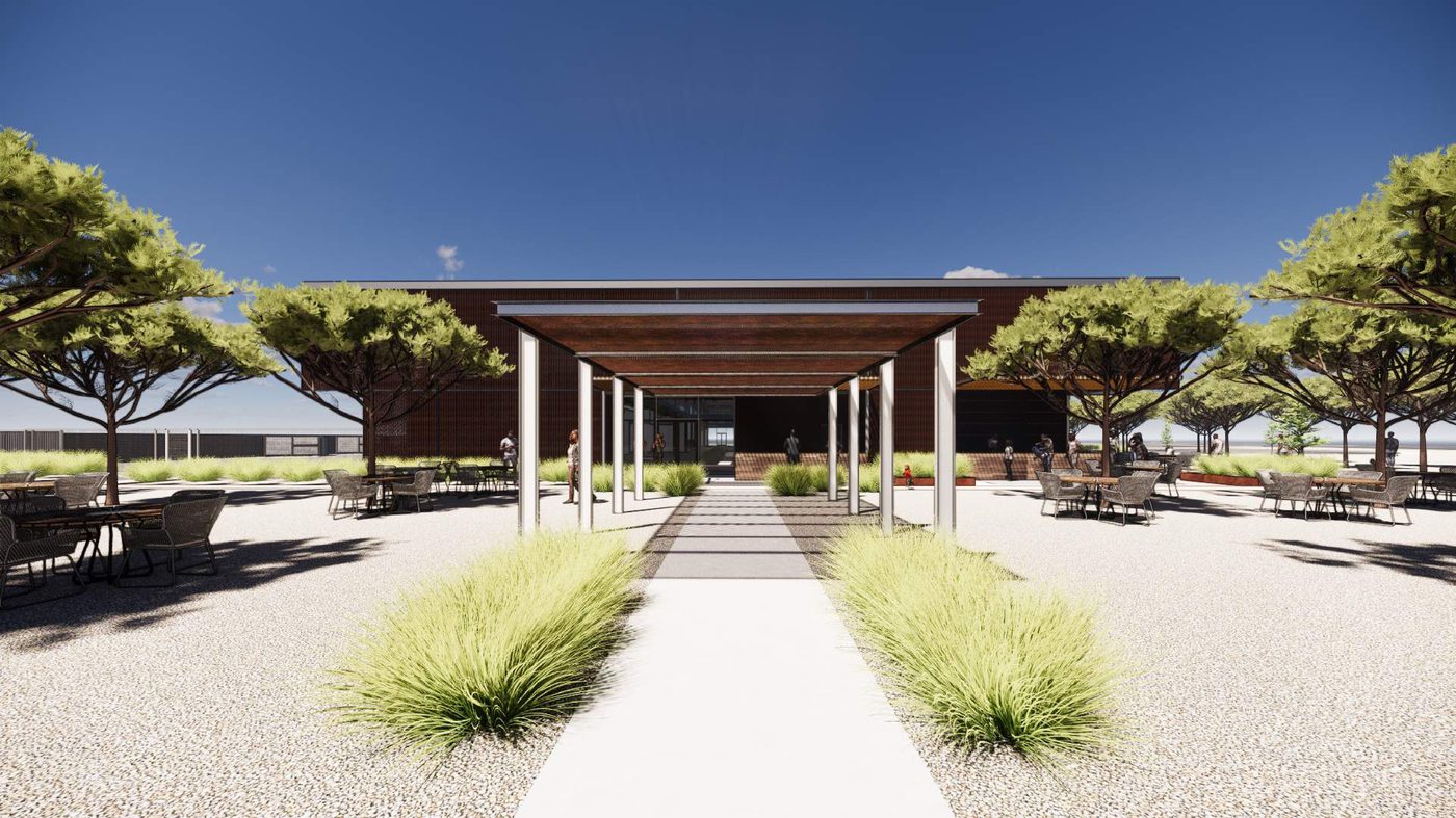 Shaded pedestrian walk leading to the market entrance